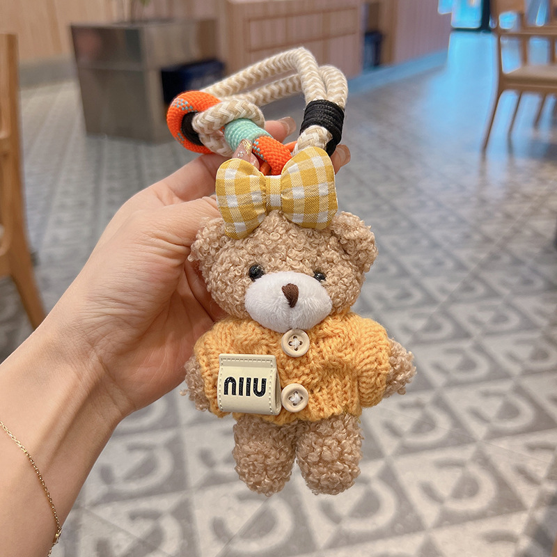 新商品のアニメの蝶結びのセーターの熊の車のキーホルダーのアイデアのぬいぐるみのカバンの装飾の女性