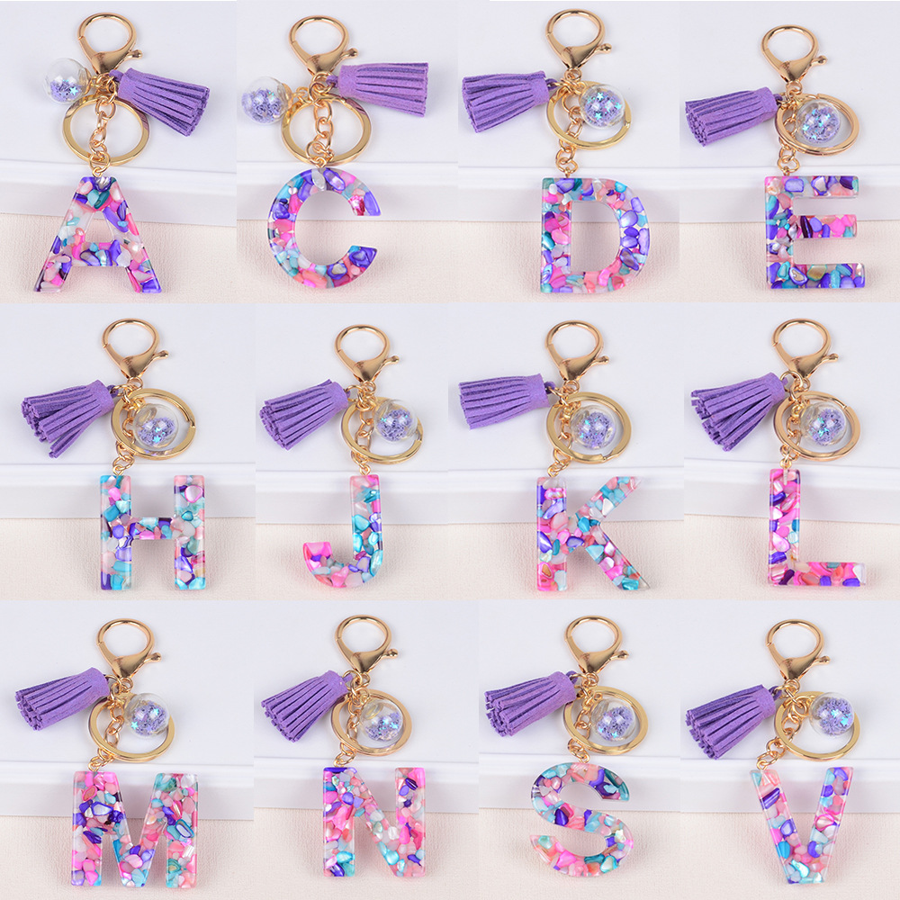 Moda estilo europeo y americano 26 inglés letras llavero cristal epoxi color piedra letra borla colgante bolsa