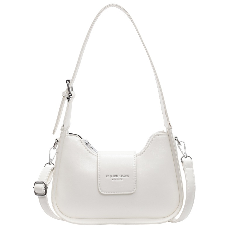 Nicho Zhong simple y versátil bolso de brazo para mujeres 2025, nuevo estilo de moda casual bolso de hombro de alta sensación bolso de media luna de mano