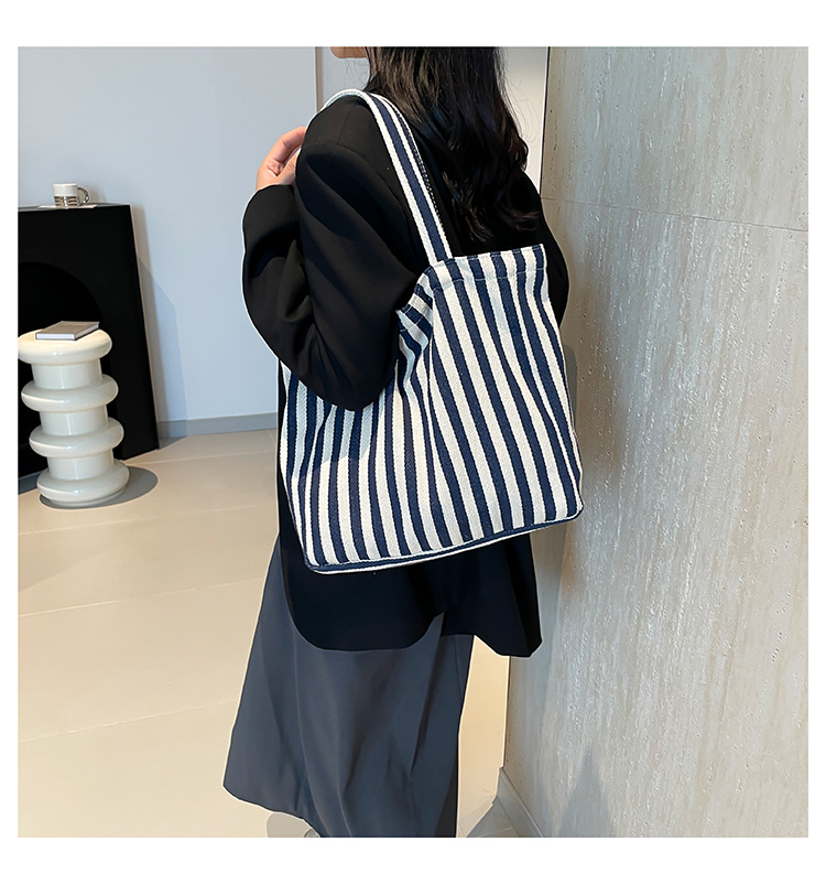 2024 Autumn/Winter new versatile and fashionable striped handbag shopping bag, two-tone large-capacity trendy single-shoulder bag undefined