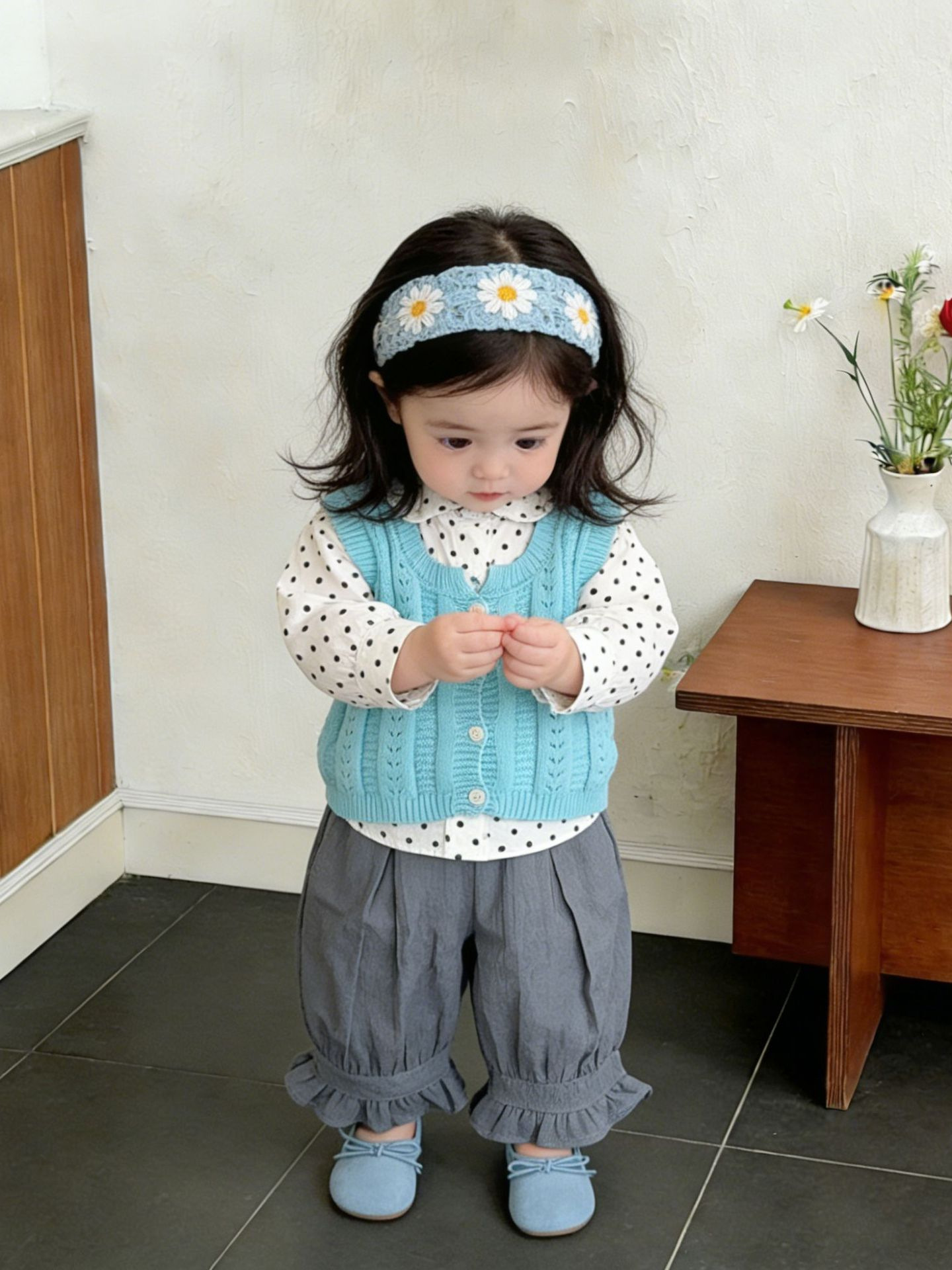 Niñas de primavera 2026 nuevo chaleco de moda de otoño estilo coreano chaleco de punto extranjero vestido de bebé sin mangas