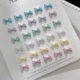 Pearlescent bow cream nail jewelry cute exquisite mixed color three-dimensional resin bag bow tie nail accessories wholesale