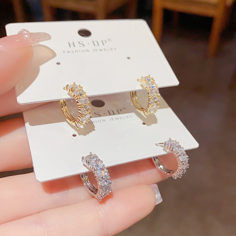 Internet celebridad estilo pequeño exquisito elegante circón oído hebilla de moda todo fósforo oído anillo nicho diseño Super Flash pequeñas gotas para los oídos pendientes