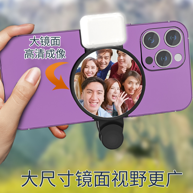 写真を撮る携帯電話の後ろには、自分で写真を撮るカメラがあります。|undefined
