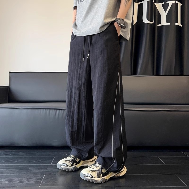 Pantalones blancos de línea clara para hombres de verano delgados pantalones deportivos de pierna ancha de marca de moda pantalones casuales de hombre rectos sueltos
