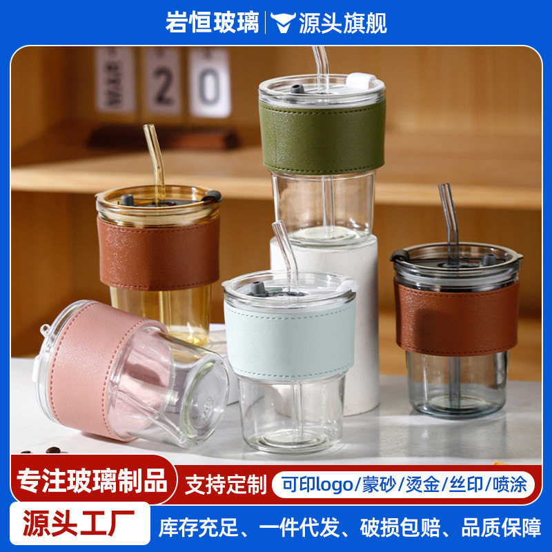 Tazas de vidrio de bambú en línea resistentes al calor tazas de paja de café ins viento alto valor de mano impresión de tazas de agua de regalo