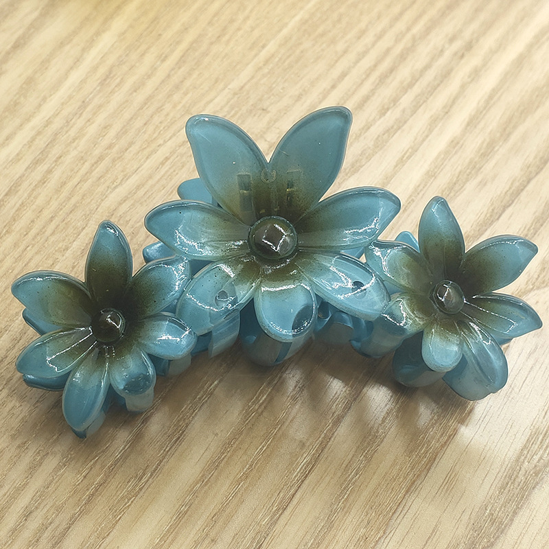 国境を越えたアマゾンの卵の花がグラデーションの花のキャンディー色の紫荊花の後頭部をつかんでサメの花を挟んで髪を伸ばします。|undefined