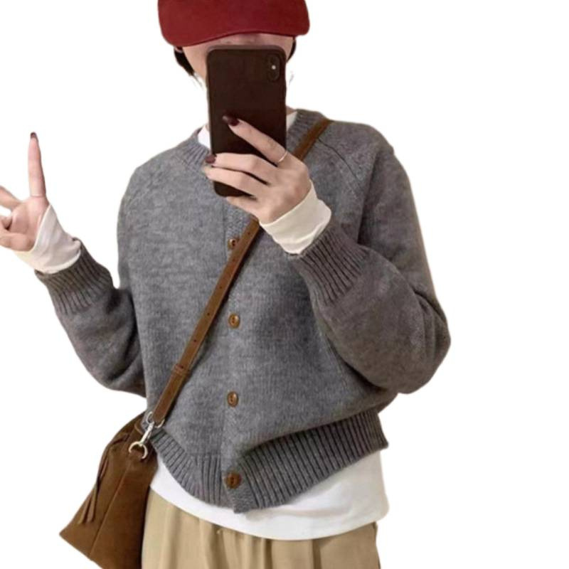 Corea del Sur 2025 otoño y invierno nuevo estilo extranjero V-cuello grueso aguja floja de color sólido jersey de punto suéter