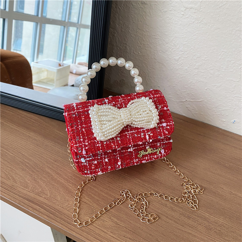 Mochila de niños estilo extranjero princesa perla de viento pequeño cambio bolso de hombro de niña encantadora