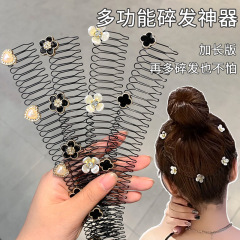 ツバキの花の砕毛櫛の毛の砕毛は神器のカチューシャを整理します。