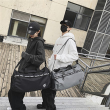 短途旅行包斜挎包男大容量手提行李袋潮牌休闲出行包女运动健身包