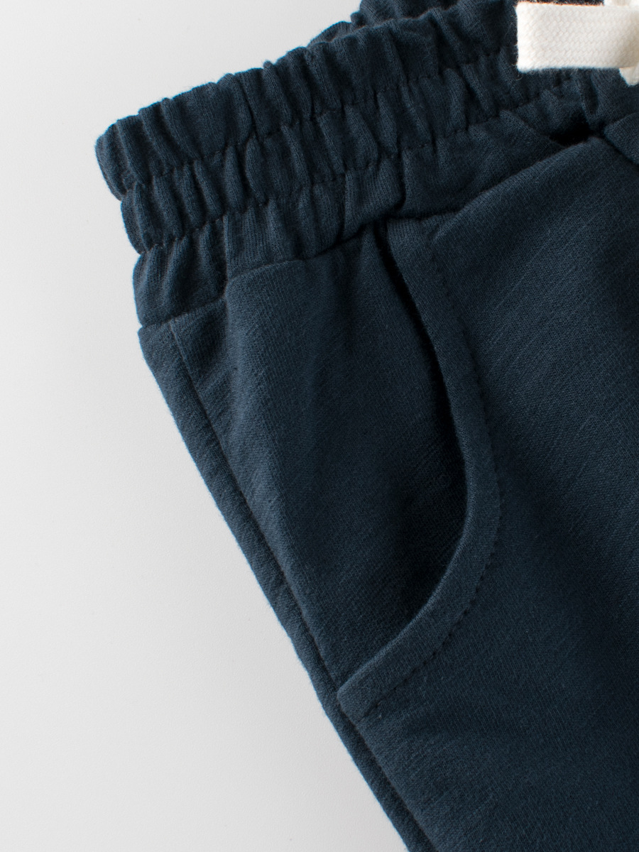 27kids Ropa infantil estilo coreano 2025 verano nuevos pantalones cortos de cinco puntos de color puro para bebés niños envío directo