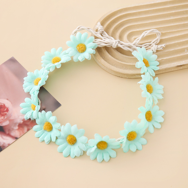 女性の女の子のヘアバンドは11輪の花の頭を編んで小さい太陽の花を持って旅行します。|undefined