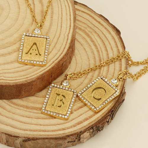 European and American INS style titanium steel sand-pressed hollow 26 English letter pendant 18K stainless steel diamond letter necklace for women