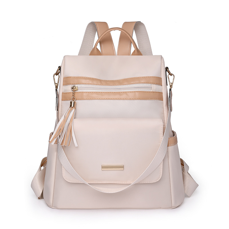 Mochila antirrobo de ocio al aire libre mujer 2024 nueva moda de nailon color de contraste borla viaje mochila de doble uso al por mayor