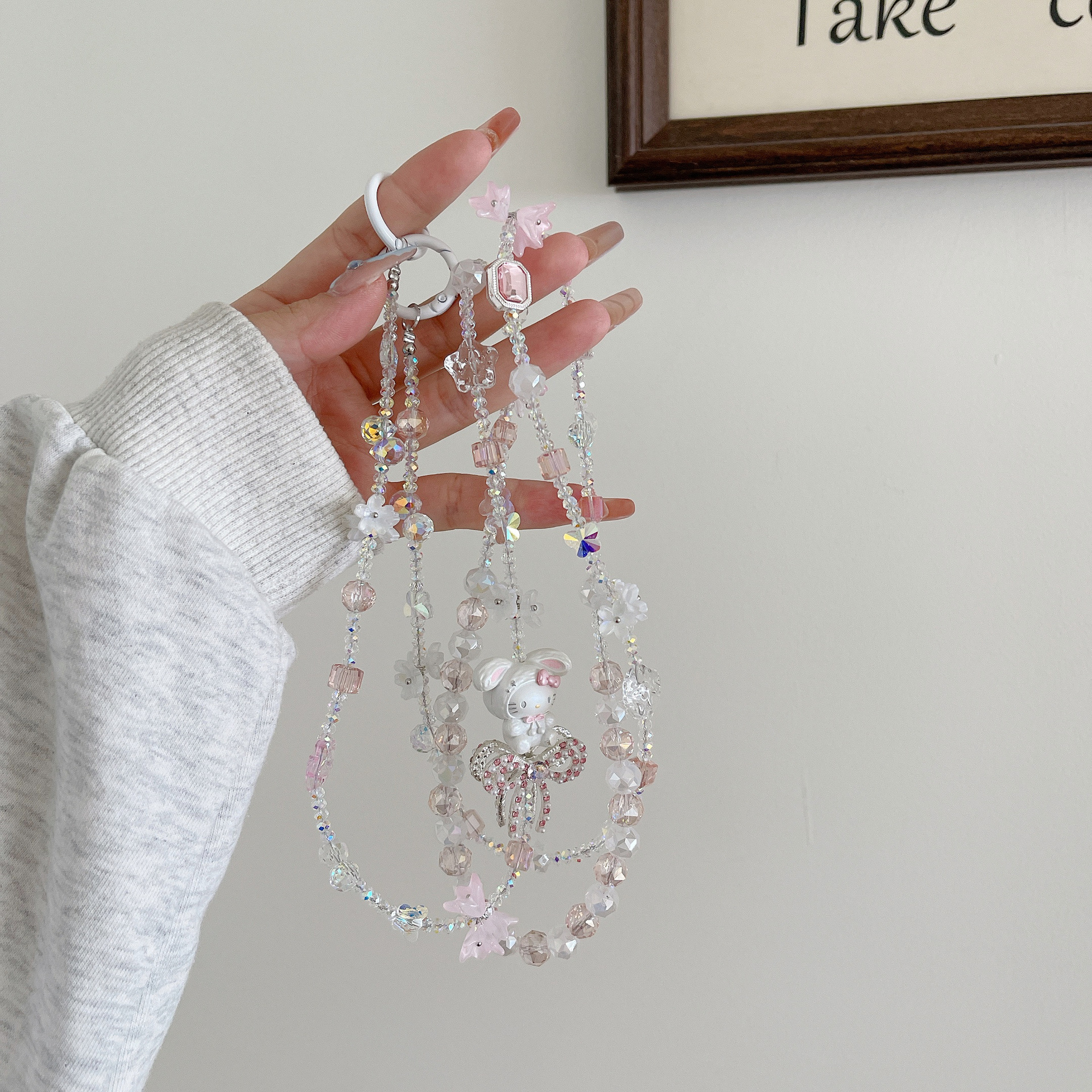 Boutique hecho a mano de alta gama para teléfono móvil cadena larga de gato KT lindo femenino cordón de teléfono móvil de moda colgante de mensajero largo