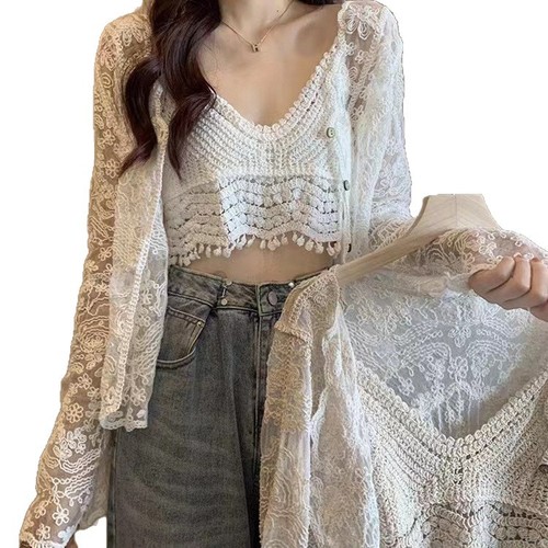 A lightweight summer shawl-style dress with spaghetti straps, paired with a lace open sweater for a fairy-like effect. It's a super fairy-like top and provides great sun protection.