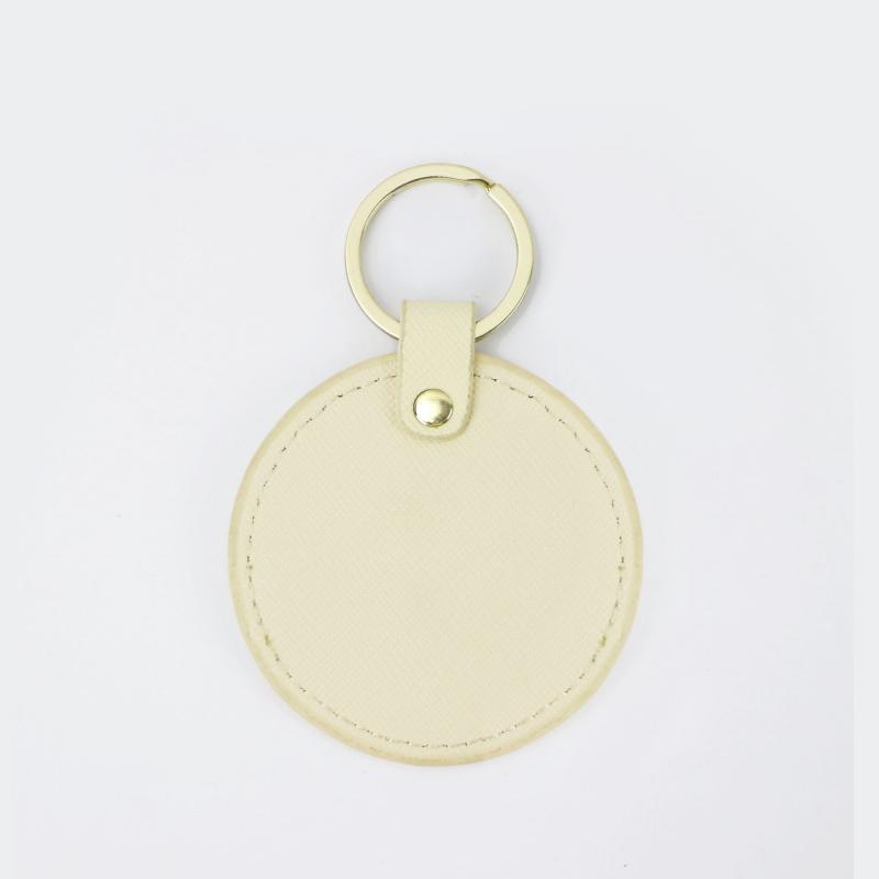 Llavero redondo de cuero genuino personalizado creativo simple colgante hombres y mujeres pequeño exquisito pequeño regalo al por mayor todo a juego