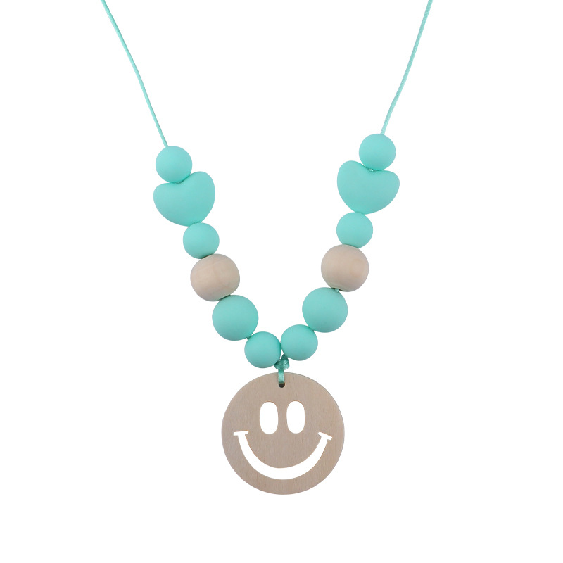 Nuevo bebé suministros smiley cara mordedor collar bebé cuentas de silicona mordida molar masticable colgante collar