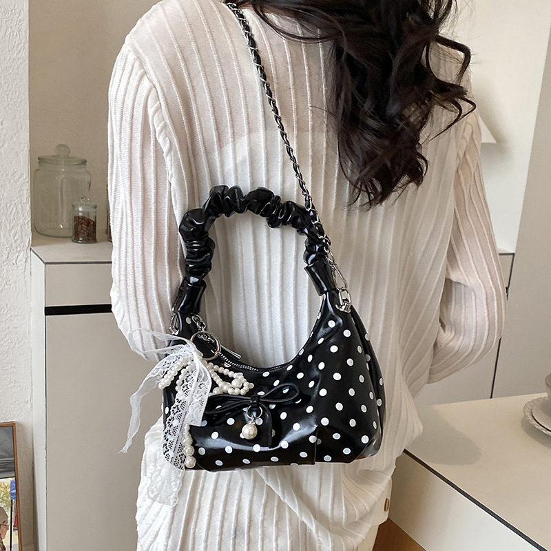 Coreana estilo extranjero suave bolso plegable mujer verano 2026 nueva moda diaria cadena mochila de hombro