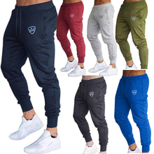 跨境夏季时尚外贸男式休闲百搭纯色抽绳开袋修身小脚裤长裤