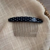 Navy blue polka dot comb