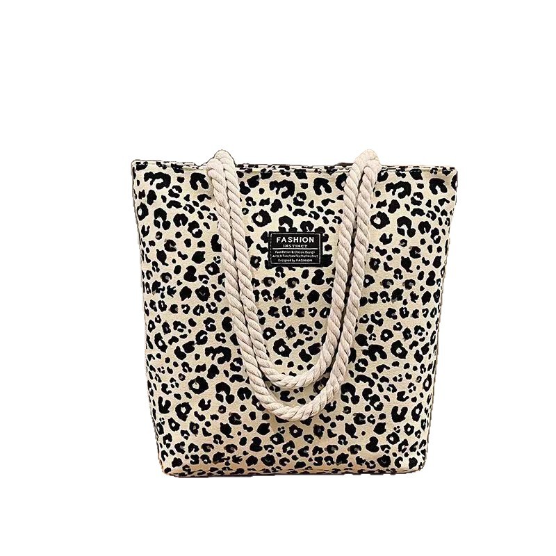 Bolso de mujer 2026 nueva impresión bolso de lona de moda leopardo coreano bolso de gran capacidad bolso de hombro de mano de compras