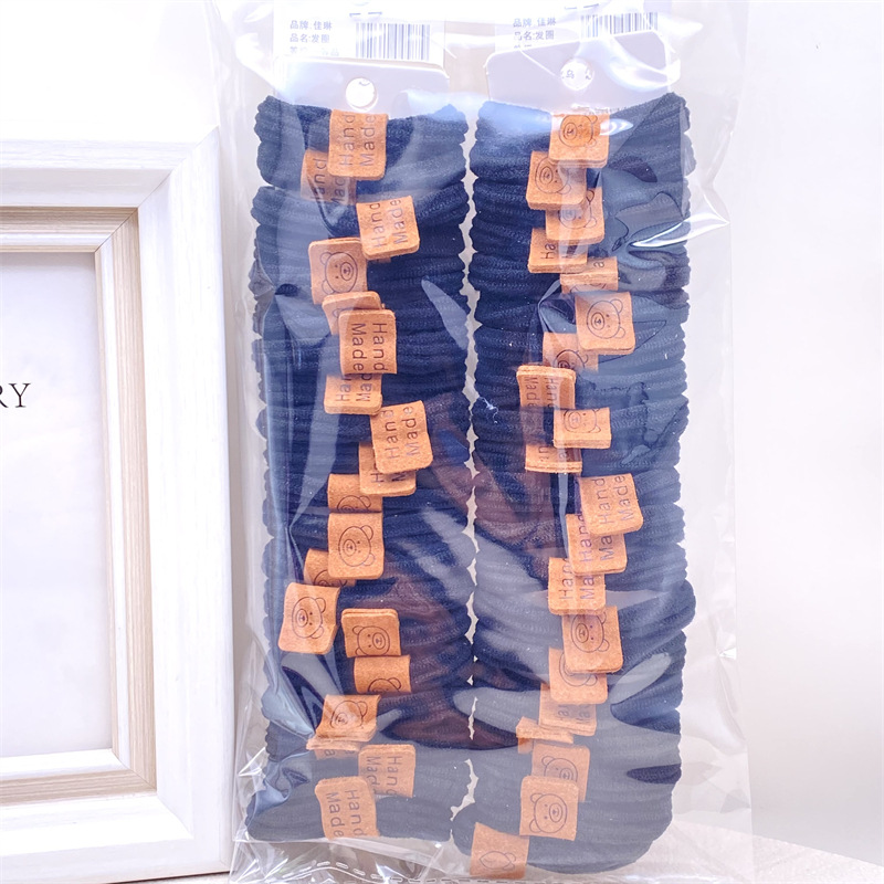 Descuento 4 tarjetas estilo coreano leche té color lindo paño etiqueta banda de pelo banda de goma de las mujeres del lazo del pelo cuerda de pelo 2 yuanes tienda accesorios