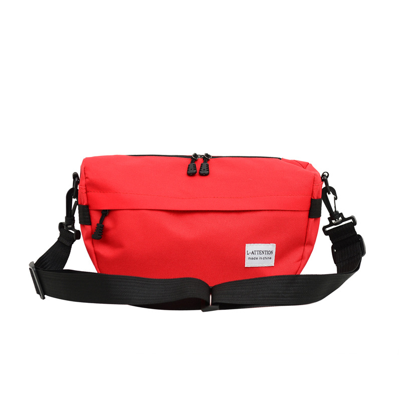 日本の斜めショルダーバッグ男性街頭ファッションブランド青年レジャースポーツシングルショルダーバッグ女性ファッション純色学生カップルバッグ