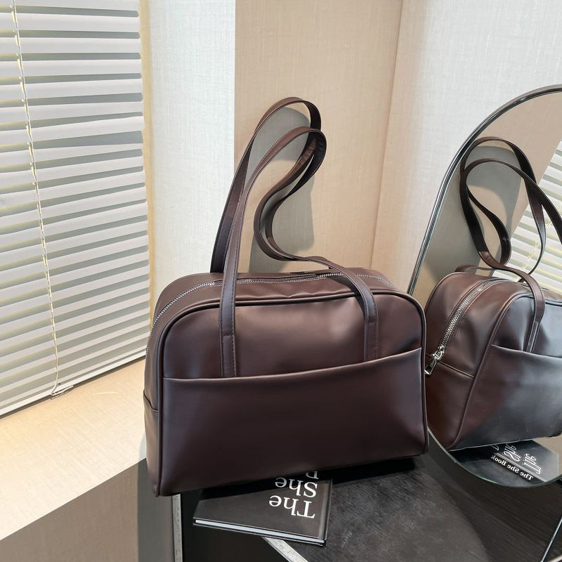 Bolso de hombro coreano de gran capacidad para mujeres 2025 primavera nuevo bolso de brazo retro estilo extranjero bolso de viento minimalista