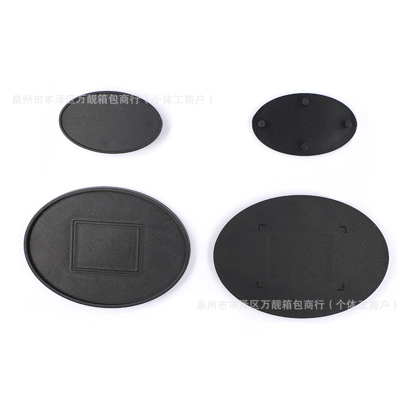 Directly from the manufacturer, oval black plastic POM backpack logo frame with an inner diameter of 56mm, rubber luggage nameplate accessories