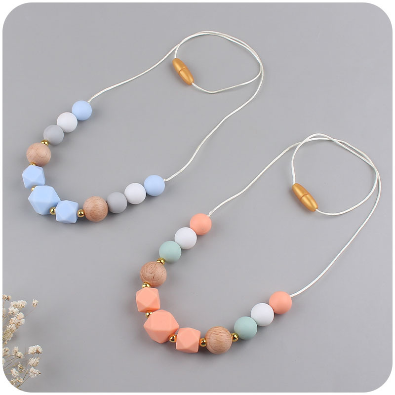 Los nuevos bebés de contraste de color de silicona octogonal mordedor collar de los bebés mordedor palo masticable colgante collar