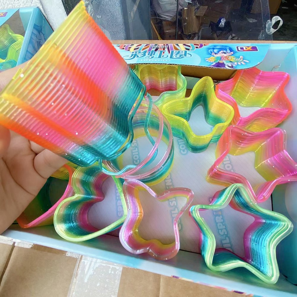 Juguetes para niños anillo de arco iris de forma especial anillo elástico bobina anillo superpuesto regalo para jardín de infantes para niños y niñas puzzle