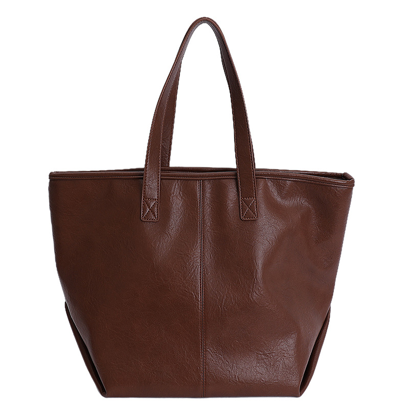 Bolsa de moda retro de gran capacidad para mujeres 2025 nueva simple versátil alta sensación de mochila de viaje diario