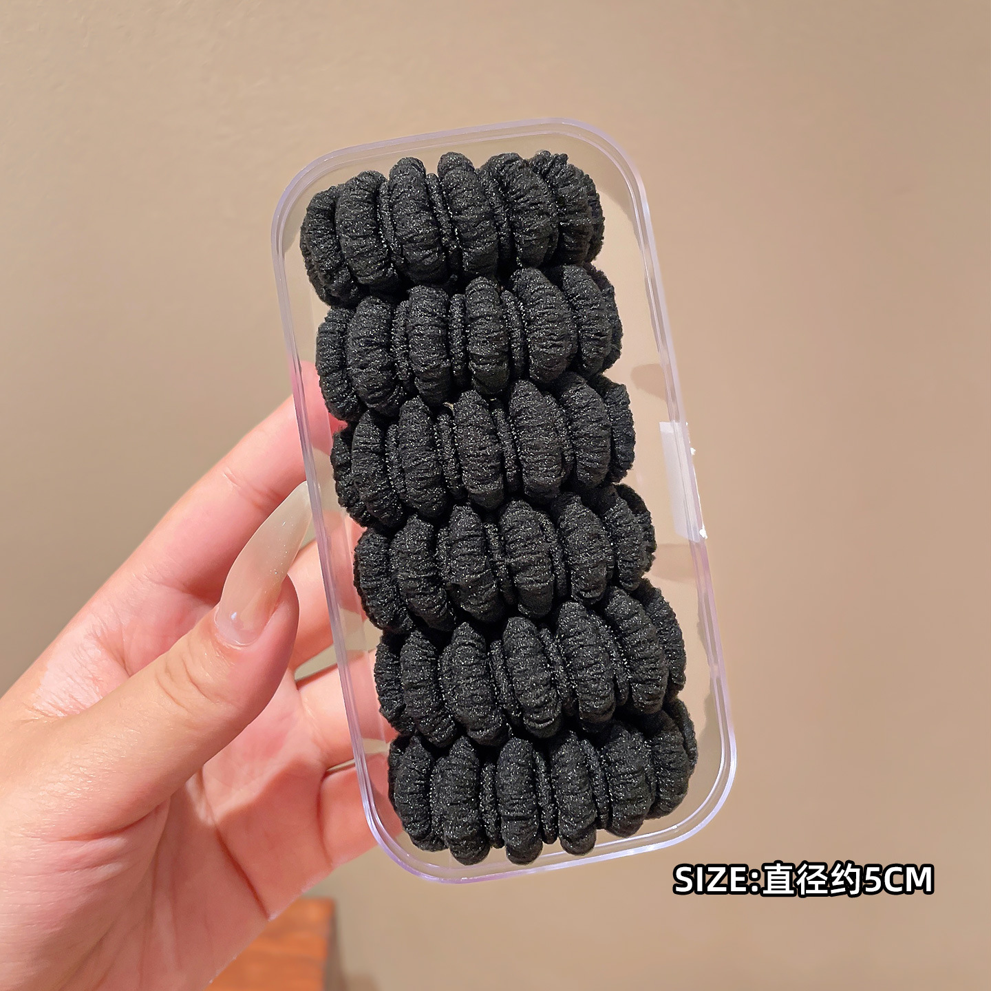 Banda elástica de lana negra.