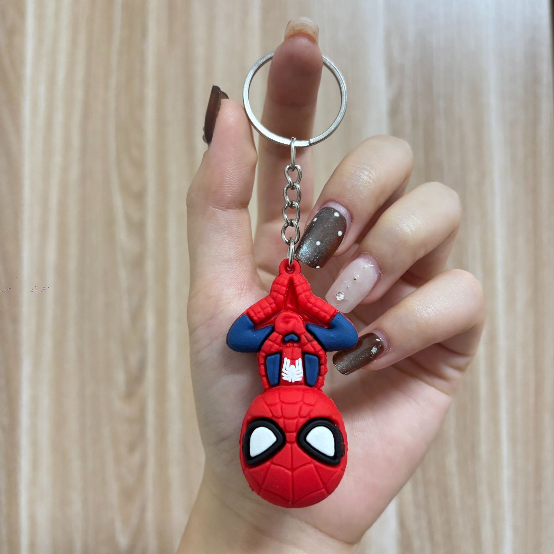 Four-link chain Spider-Man* hanging upside down