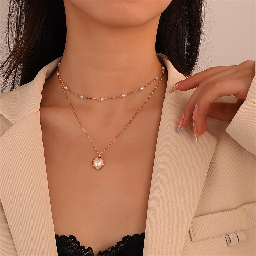 Retro Stacked Double-layer Pearl Heart Pendant Alloy Clavicle Chain display picture 2