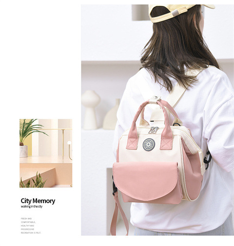 The Mommy bag is small and cute. It has a detachable front pocket and is a multi-functional baby bag. It is waterproof, lightweight, and has a crossbody design. It can be used to carry milk bags undefined