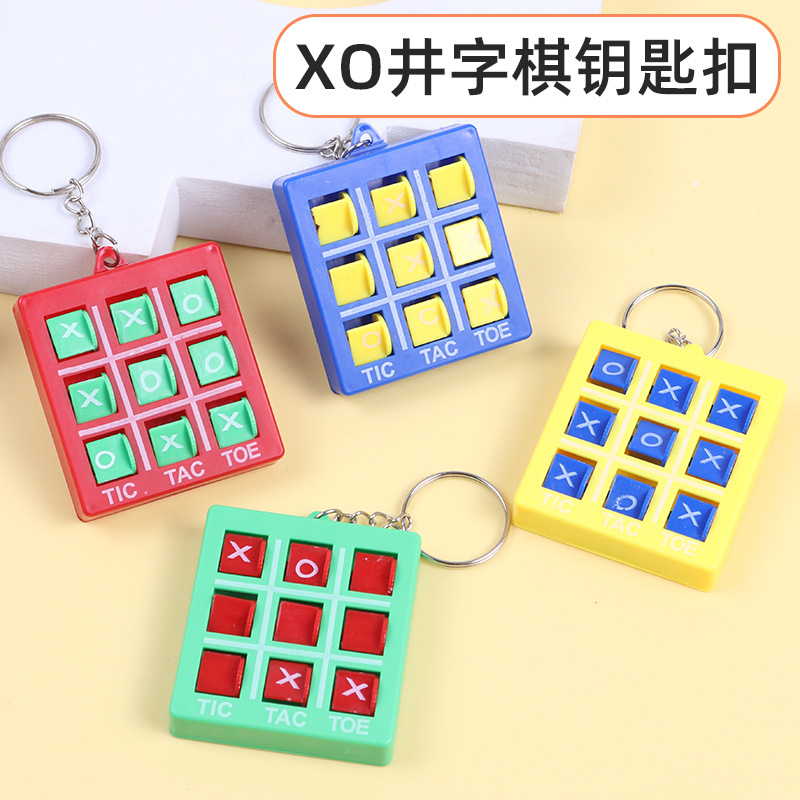 Juego tres en raya XO horquilla colgante, rompecabezas viaje llavero, juguete regalo transfronterizo para niños.
