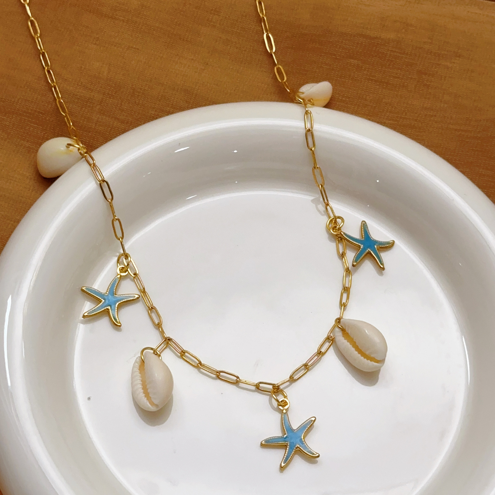 Europeo y americano transfronterizo nuevo estilo concha estrella de mar collar femenino estilo océano vacaciones moda joyería de todo fósforo concha acero inoxidable