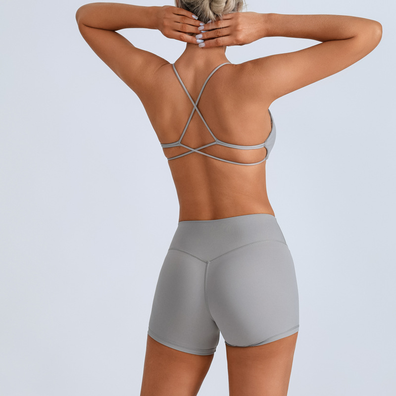 Traje de yoga europeo y americano transfronterizo, espalda hermosa con almohadilla para el pecho, sujetador con tirantes cruzados, pantalones deportivos de secado rápido de melocotón de cintura alta