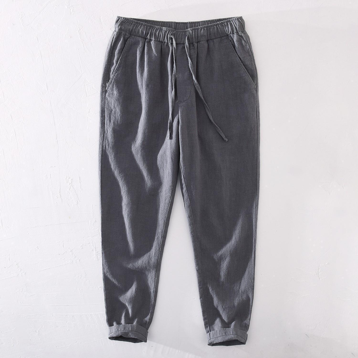 Pantalones casuales de lino rectos de algodón y lino con cintura elástica retro extremadamente cáñamo pantalones de lino sueltos de todo fósforo con cordón para hombres