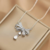 Zirconium with bow, pendant, small design necklace, diamond encrusted, light luxury style, trend of season, 2022 collection