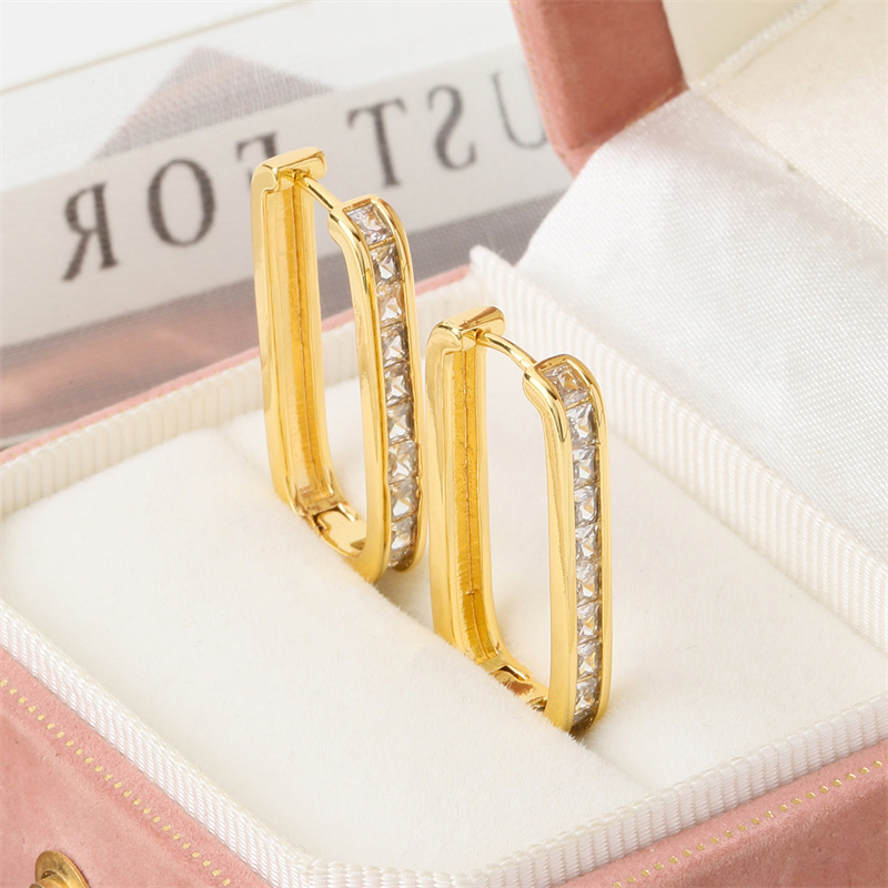 Elegant copper geometric rectangular fashionable trend earrings with…