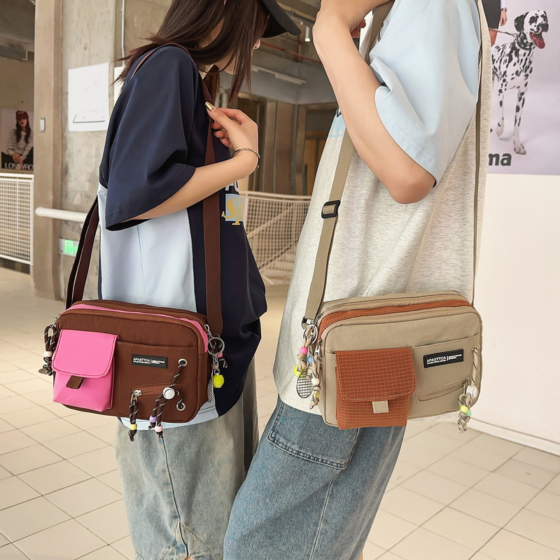 Japanese-style workwear-inspired high-fashion color-blocked crossbody bag, unisex street fashion design, versatile shoulder bag Japanese-style workwear-inspired high-fashion color-blocked crossbody bag, unisex street fashion design, versatile shoulder bag