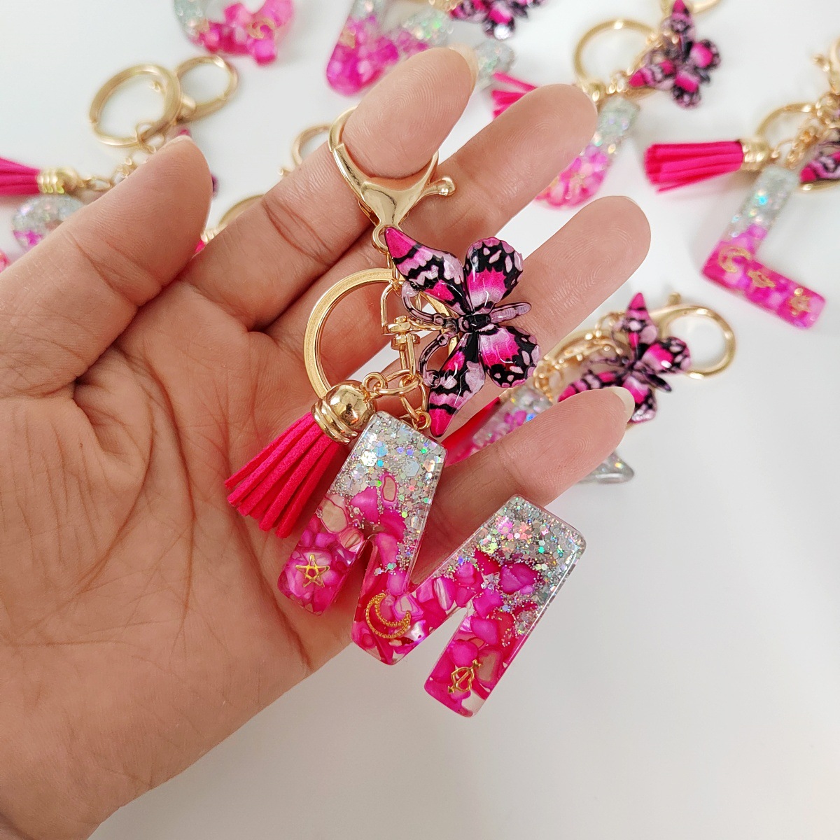 Inventario transfronterizo nueva resina bicolor mariposa borda llavero colgante estrella luna accesorios de joyas