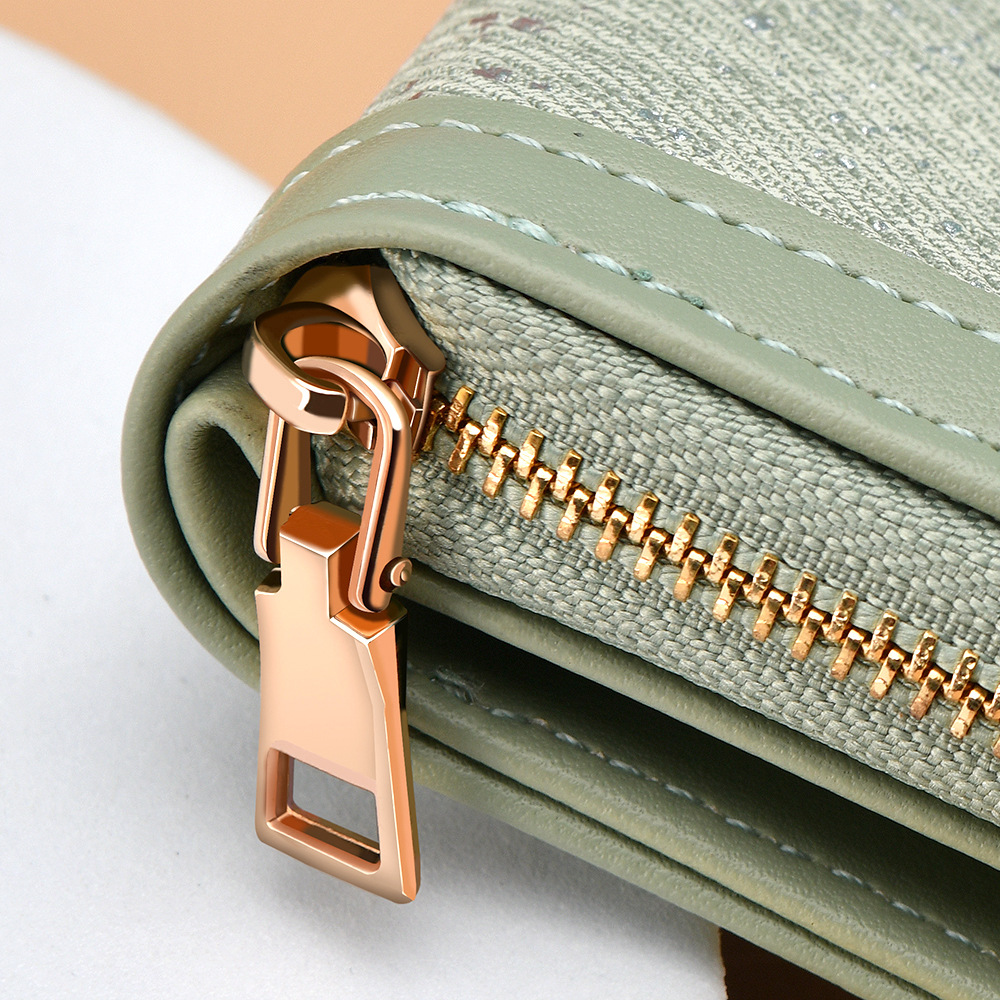 Cartera transfronteriza para mujeres nueva y fresca bolsa de tarjetas con cremallera PU pequeña bolsa de cambio plegable corta de dama alta sensación de cartera