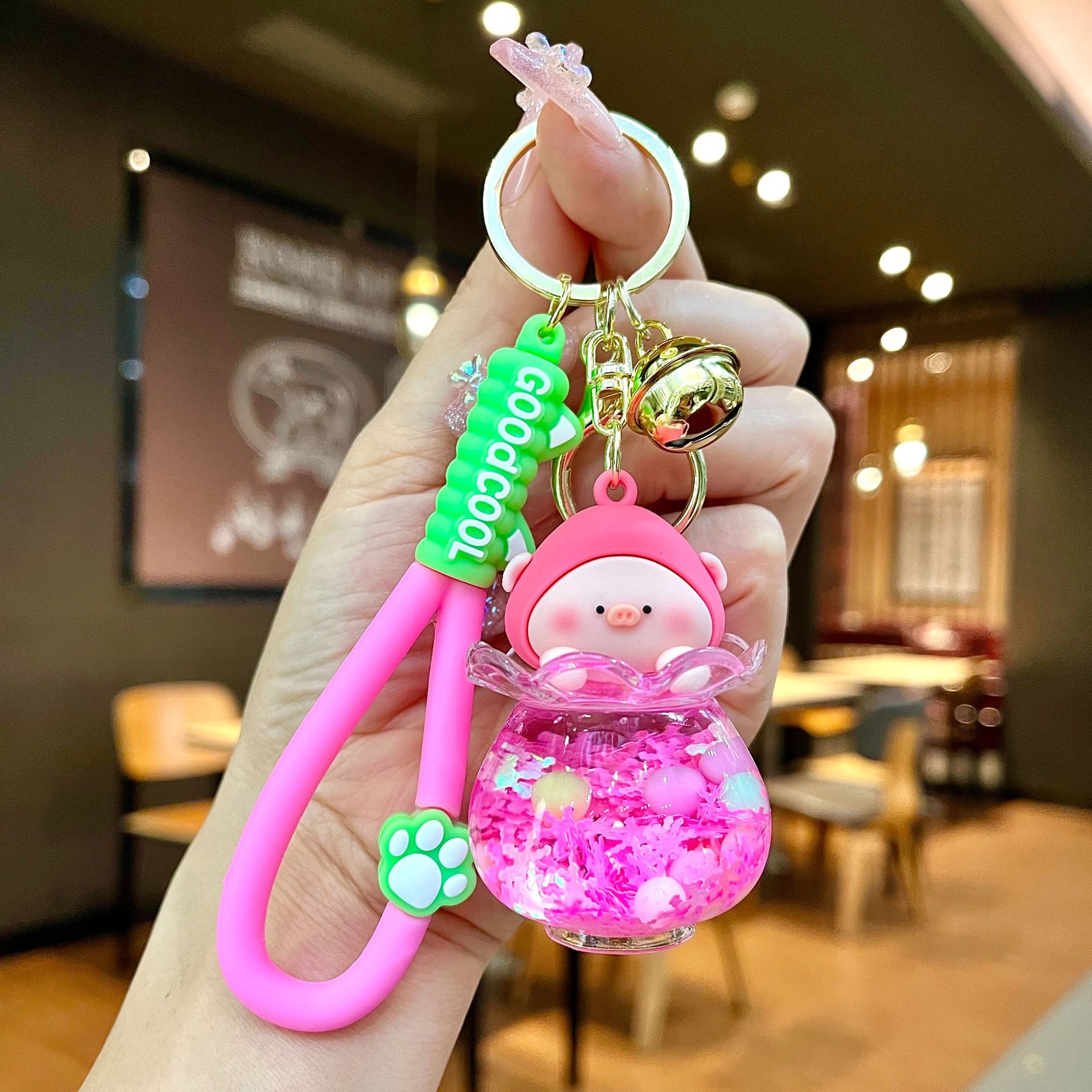 Aceite de gato garra arenas movedizas llavero lindo dibujos animados cadena colgante captura muñeca máquina agarrar pequeño regalo al por mayor