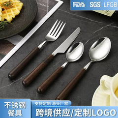 430ステンレスの実木の柄の食事のナイフのフォークのスプーンの茶の羽の木の取っ手のホテルの洋食の食器のナイフのフォークのスプーンのセット