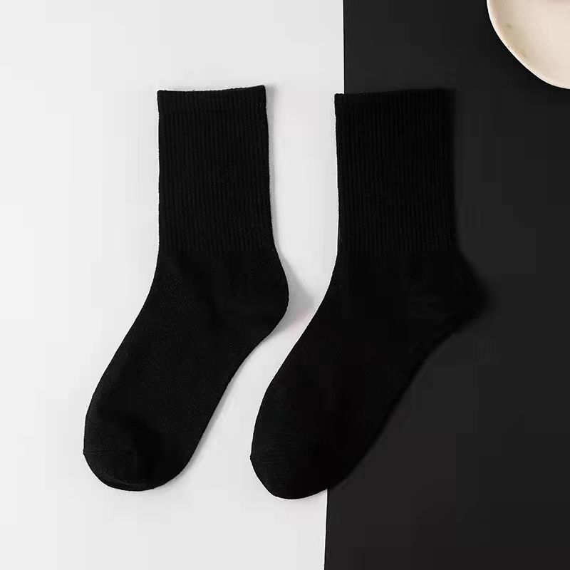 Strict selection of solid color black and white high socks men's winter socks winter women Zhuji sports casual socks wholesale market